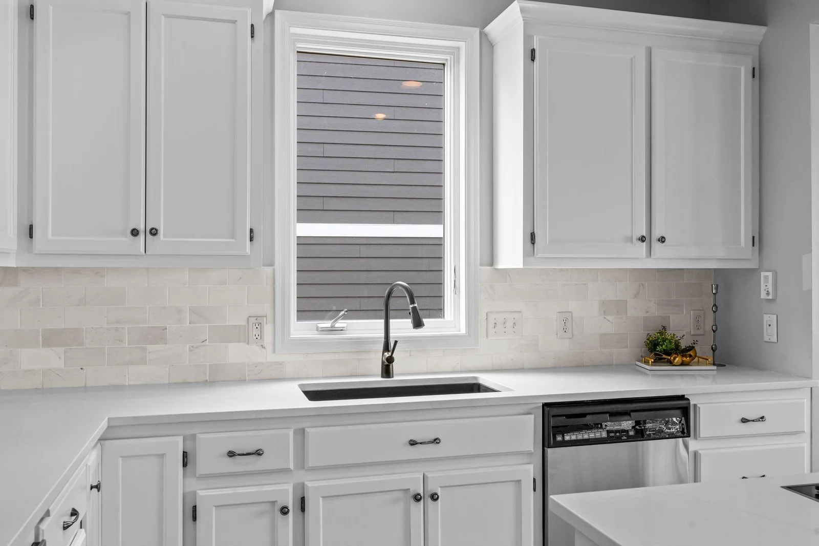 New stone counters, faucet, tile backsplash & stainless appliances