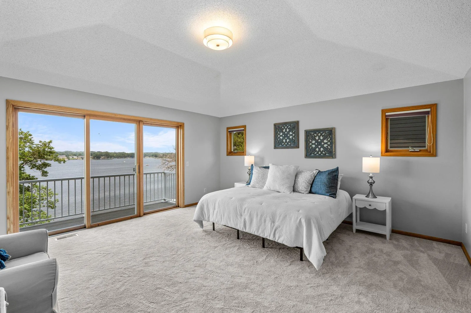 Spacious primary suite with deck access & wonderful views