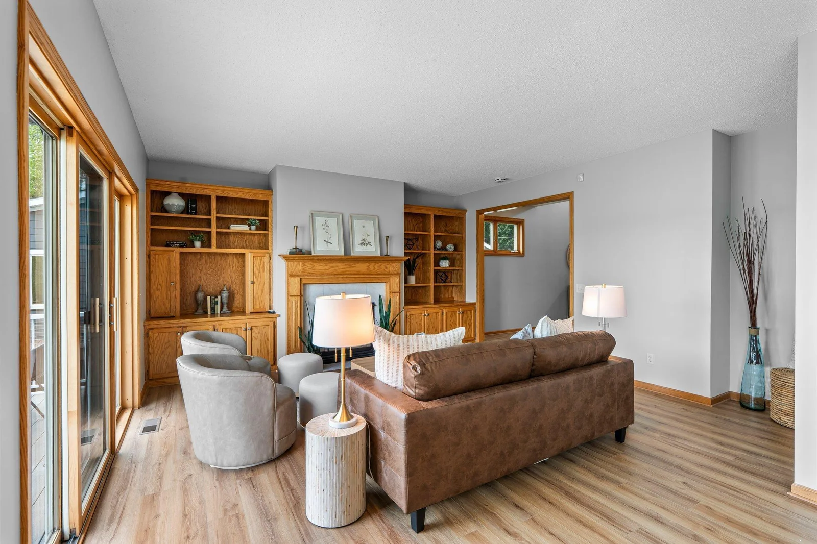 Living room features built-ins & new wood floors