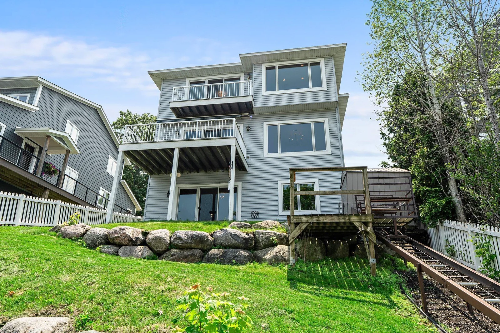 Backyard features a lift down to the lake