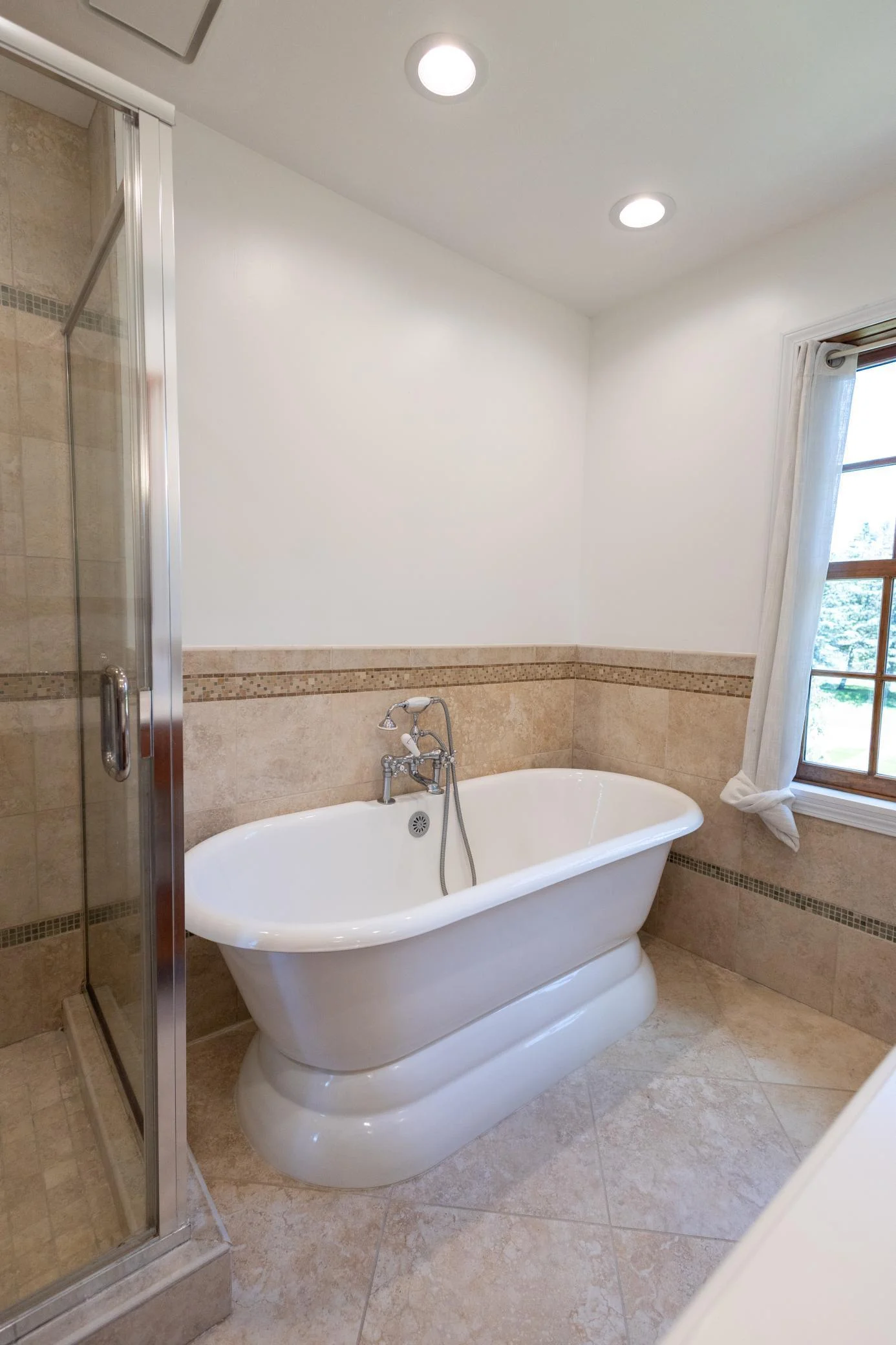 The primary bathroom has a separate tub and shower.