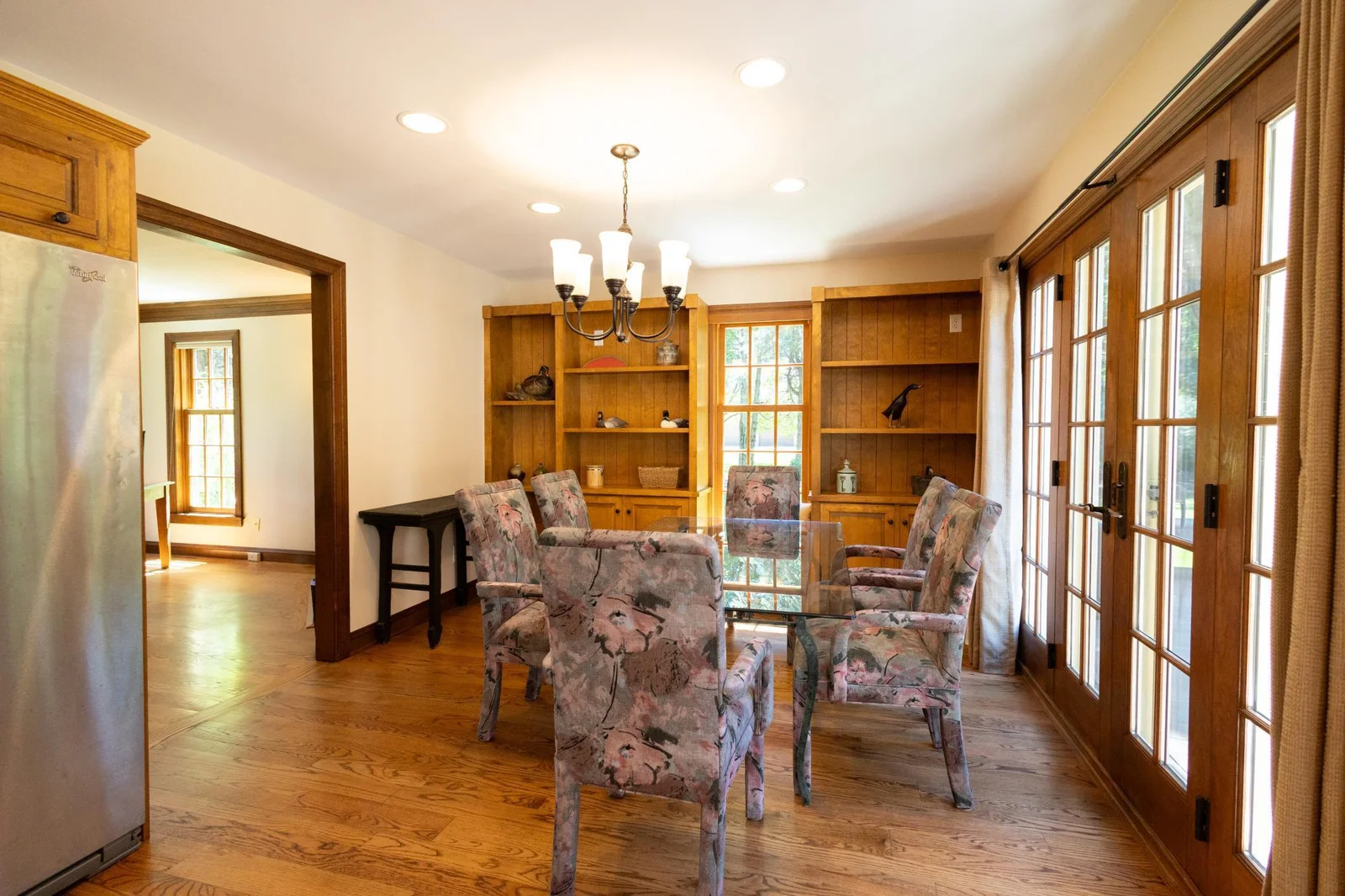 The dining room has built-ins and opens to the kitchen and the office.