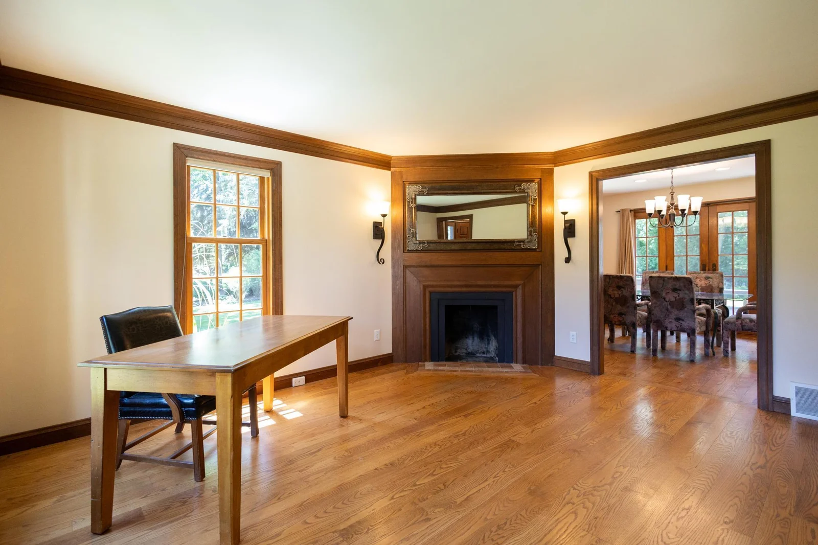 The office faces the front of the home and has a wood burning fireplace.