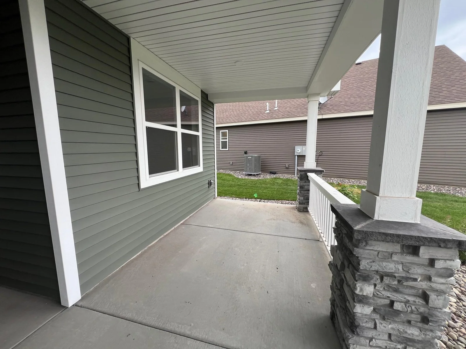 Photo is of the actual home. A spacious front porch to welcome guests and enjoy the outdoors!