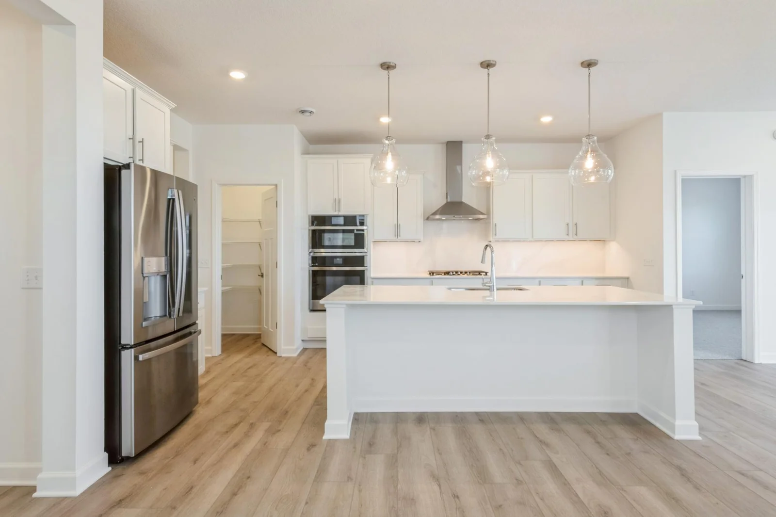 Photo is of the actual home. Features a gourmet kitchen
