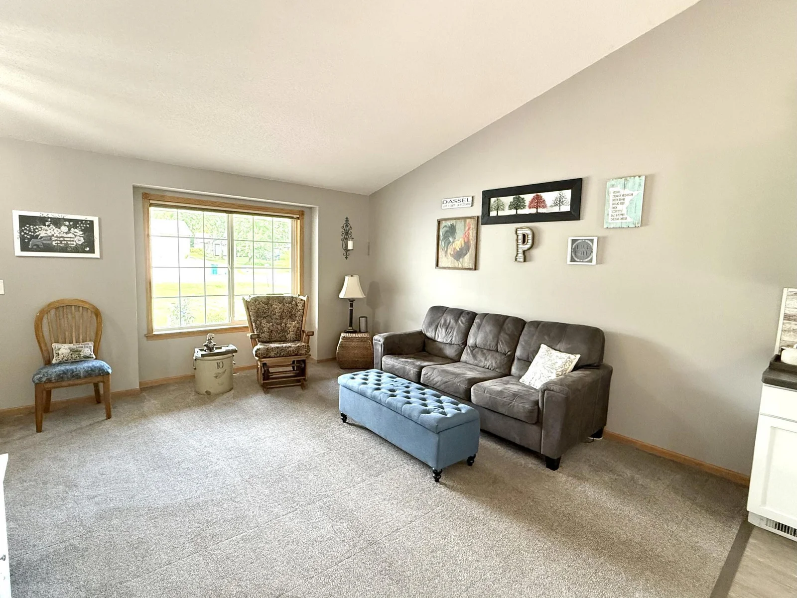 Main Level LR has new carpet and vaulted ceilings. Open concept to Kitchen and Dining Area. Great space for entertaining!