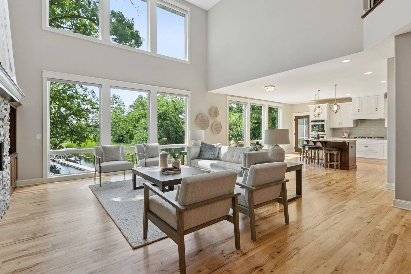 Great Room Main Level with floor with expansive windowscapes capturing views of the lake