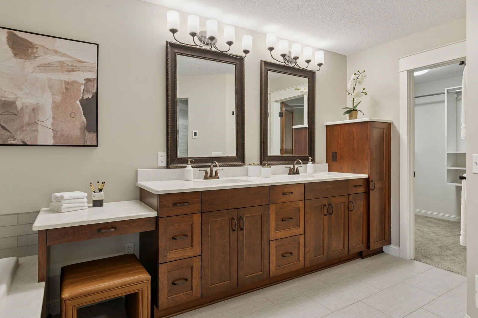 Spa-like Primary Bathroom with separate tub and shower, custom cabinetry, dual sink, ample storage.