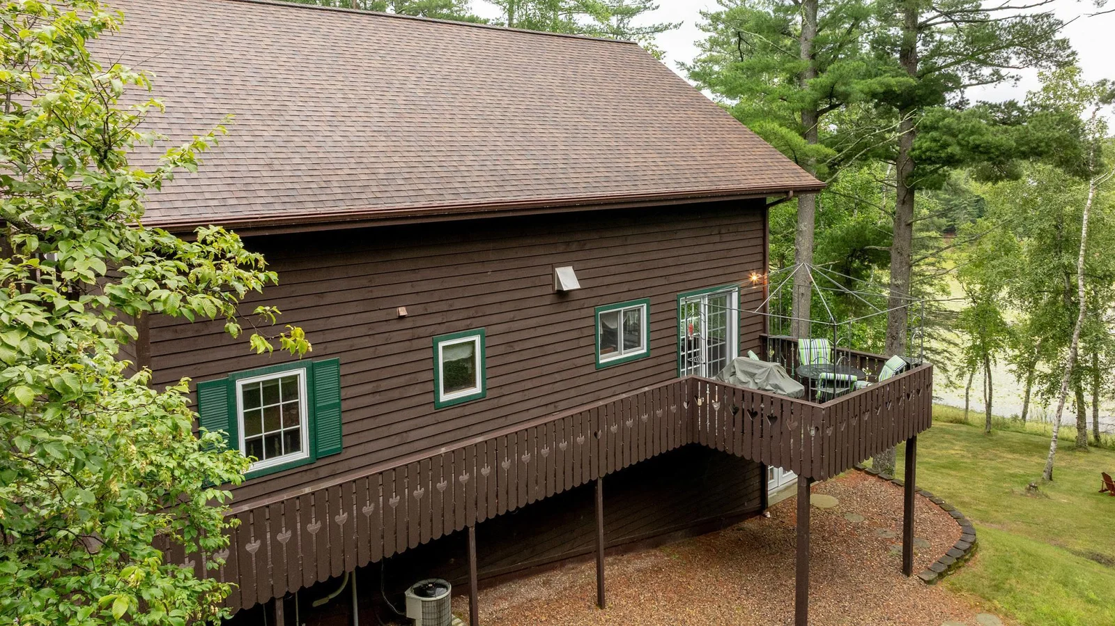 Side with wrap deck and porch