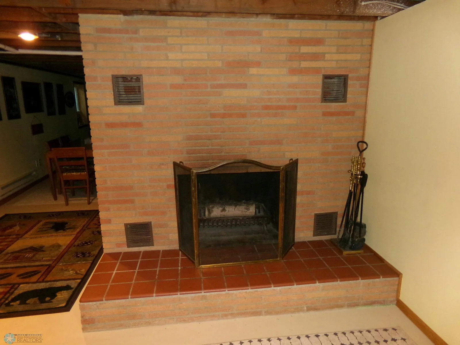 Basement Family Room Wood Fireplace.JPG